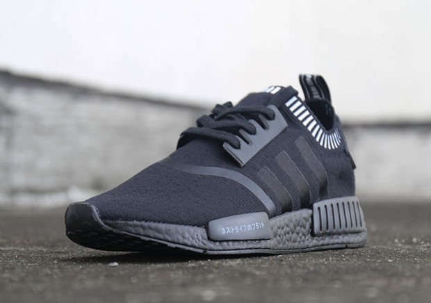 black nmds with chinese writing